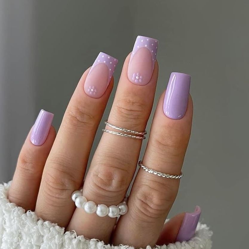 Discover the charm of spring with 'Lavender Whimsy Nails,' featuring playful polka dots and a lavender palette, perfect for tapping into the serene beauty of May's blooming lavender fields.
