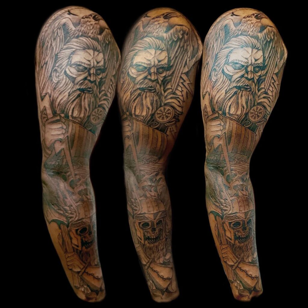 A triptych leg tattoo of Odin with his ravens and wolves, symbolizing Norse wisdom and guardianship.