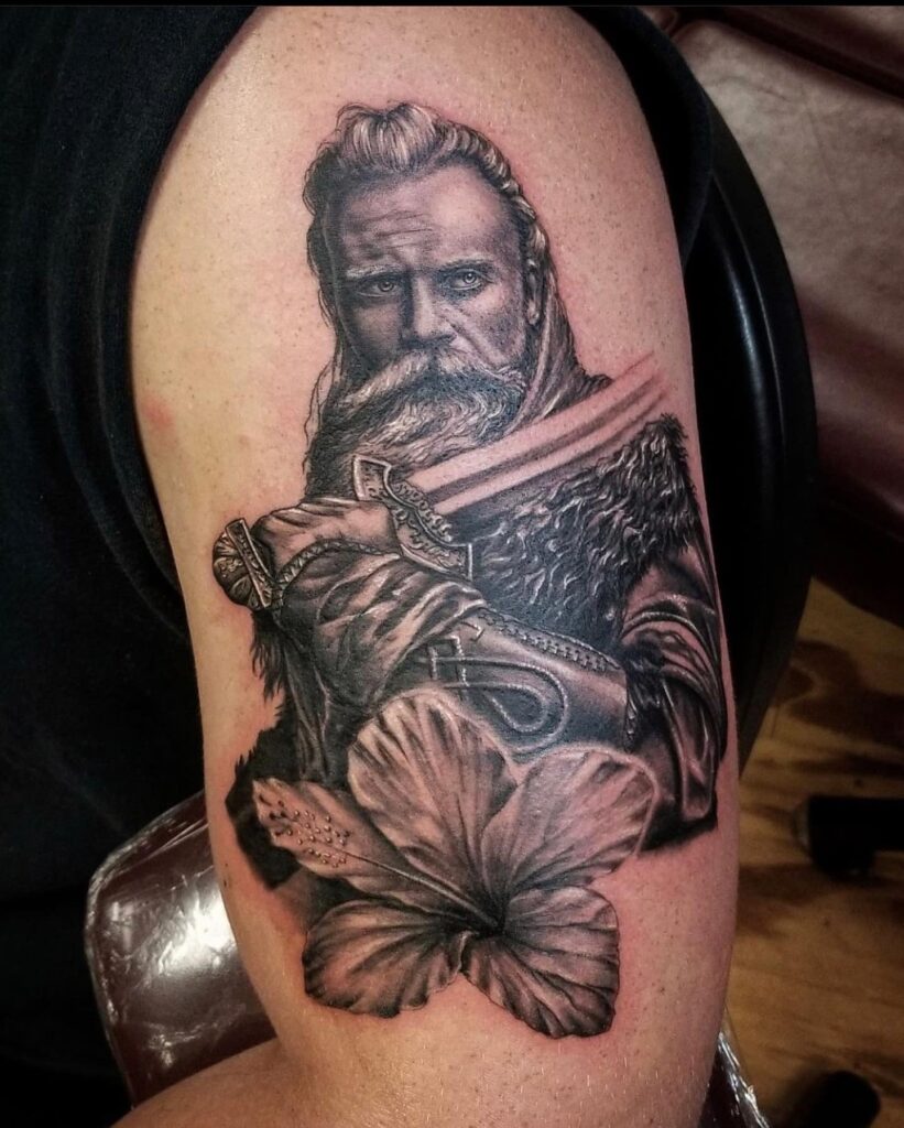 A highly detailed tattoo of a stoic Viking warrior, exemplifying the strength and resolve of the Norse.