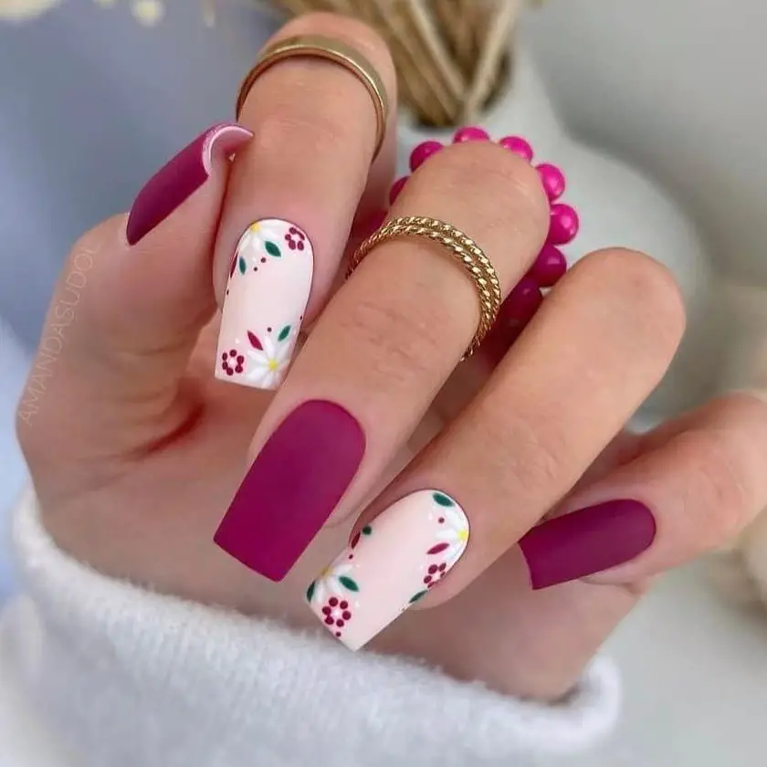 Berry Botanical: Matte berry tones interspersed with white florals create a lush and dynamic contrast, blending nature's hues with modern nail art.