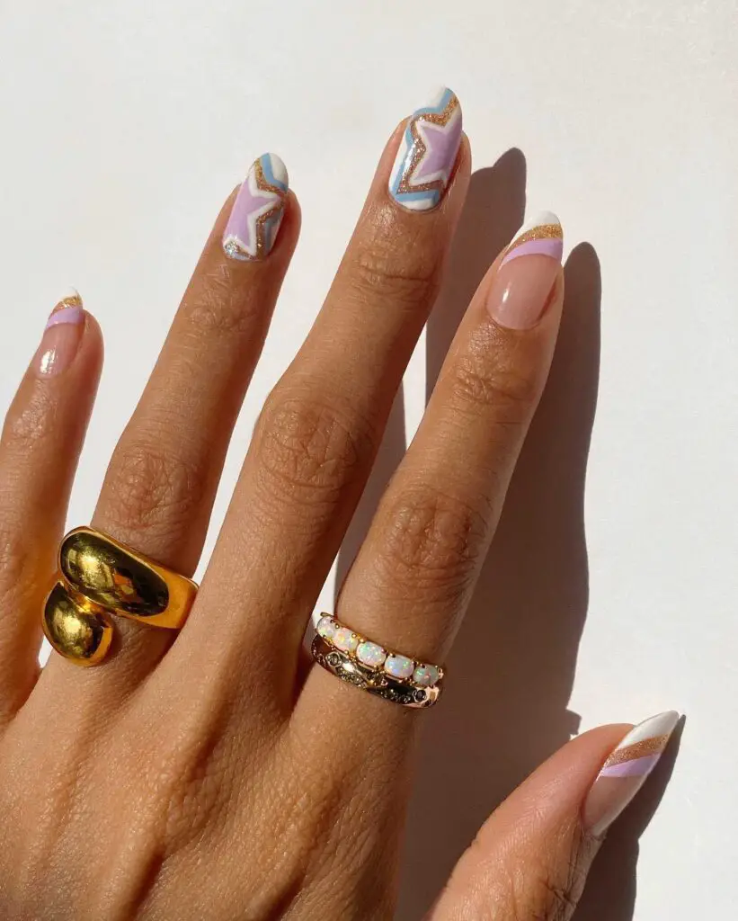 A display of nails painted with pastel colors and adorned with geometric patterns and gold highlights, reflecting a creative spring-inspired nail design.