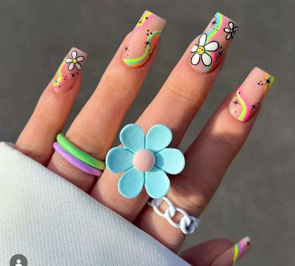 Springtime Splendor: Embrace the exuberance of spring with nails adorned in pastel rainbows, cheerful florals, and uplifting smiley faces.