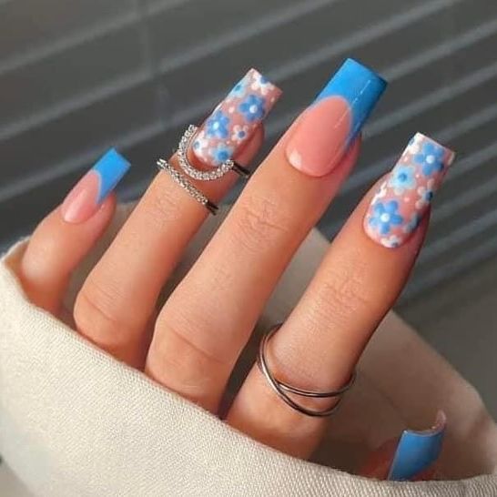 Sky Blossoms: Blue skies and fluffy clouds mingle with blue floral accents on these nails, capturing the spirit of a perfect, sunny day.
