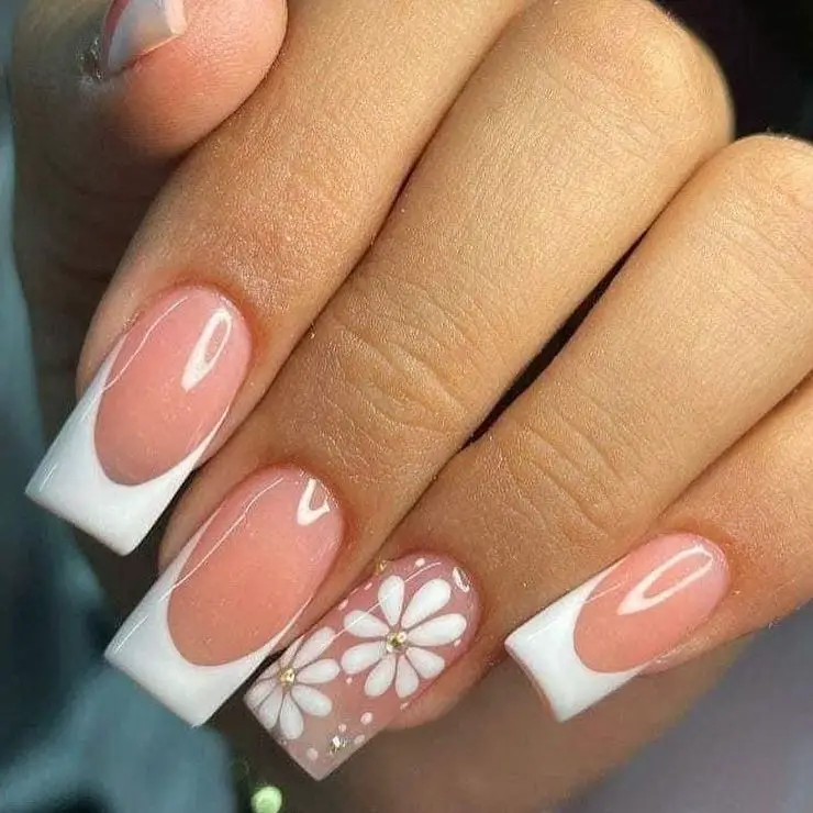 Daisy Days: The quintessential French manicure is refreshed with pink bases and white daisy designs, marrying classic elegance with springtime joy.