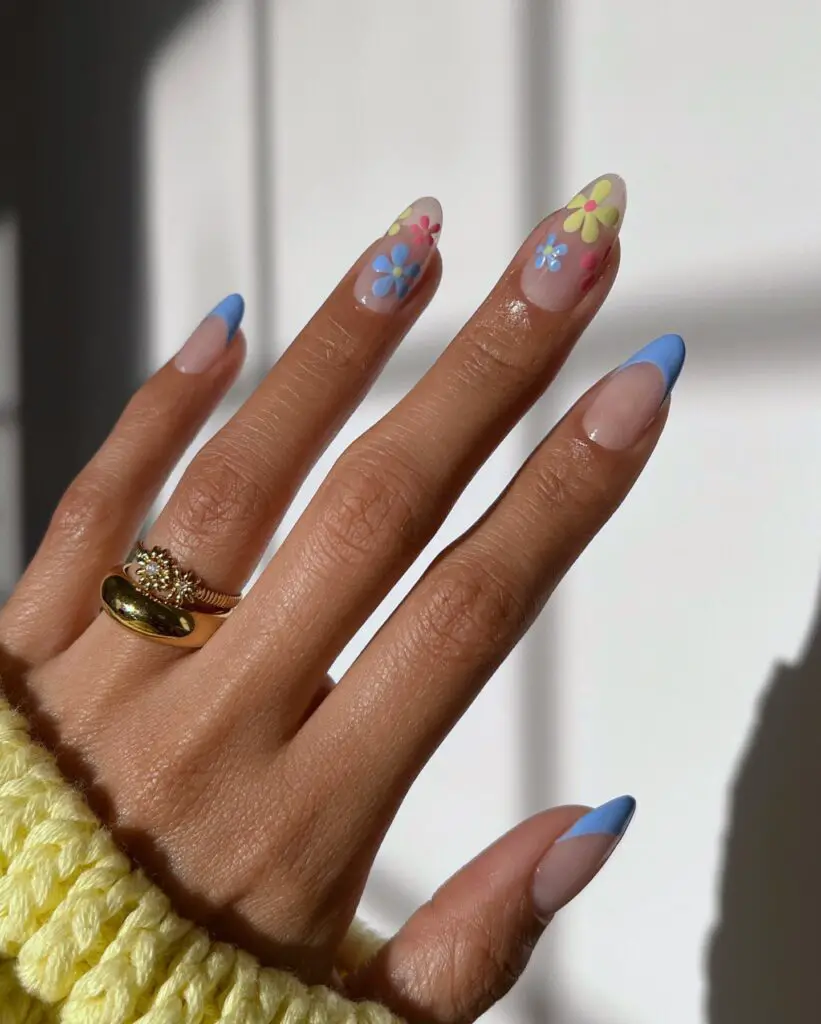 Pastel floral designs on a soft gradient base, creating a spring-inspired nail art that invokes the tranquility of a serene garden.
