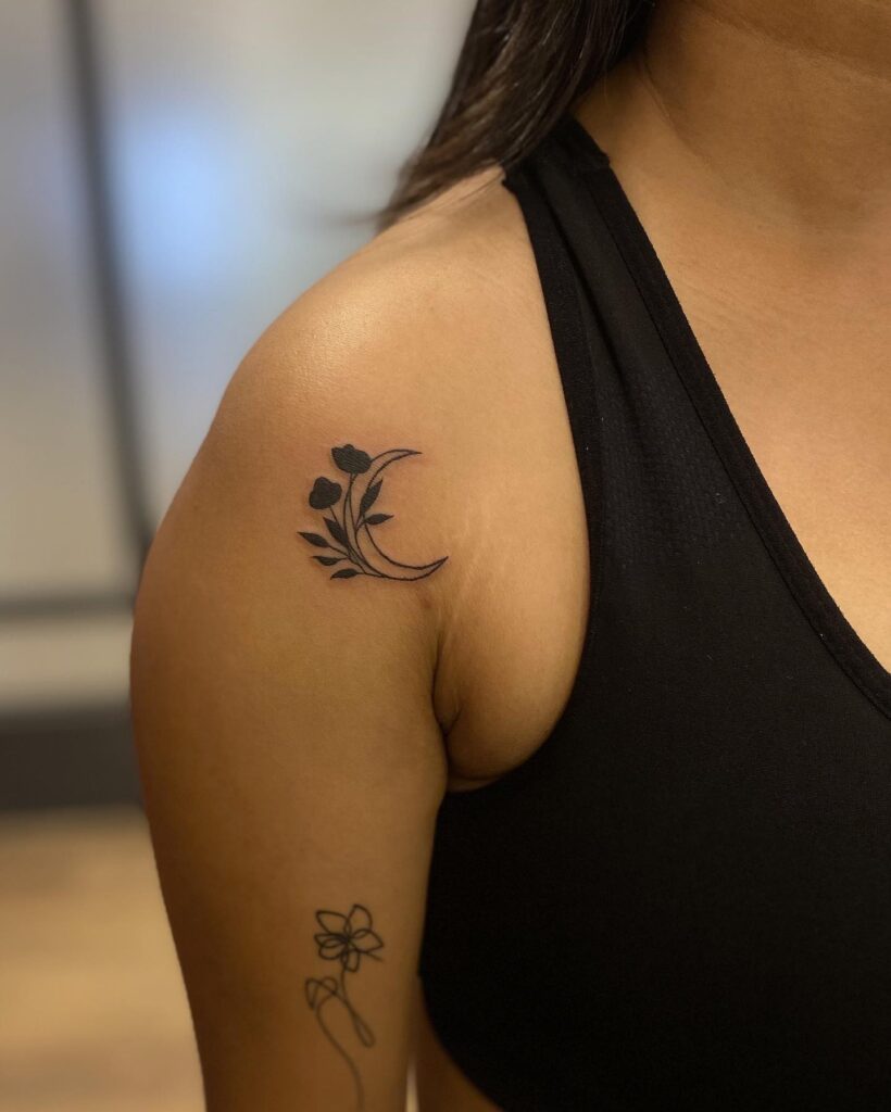 Floral Silhouette: Stylized Shoulder Tattoo