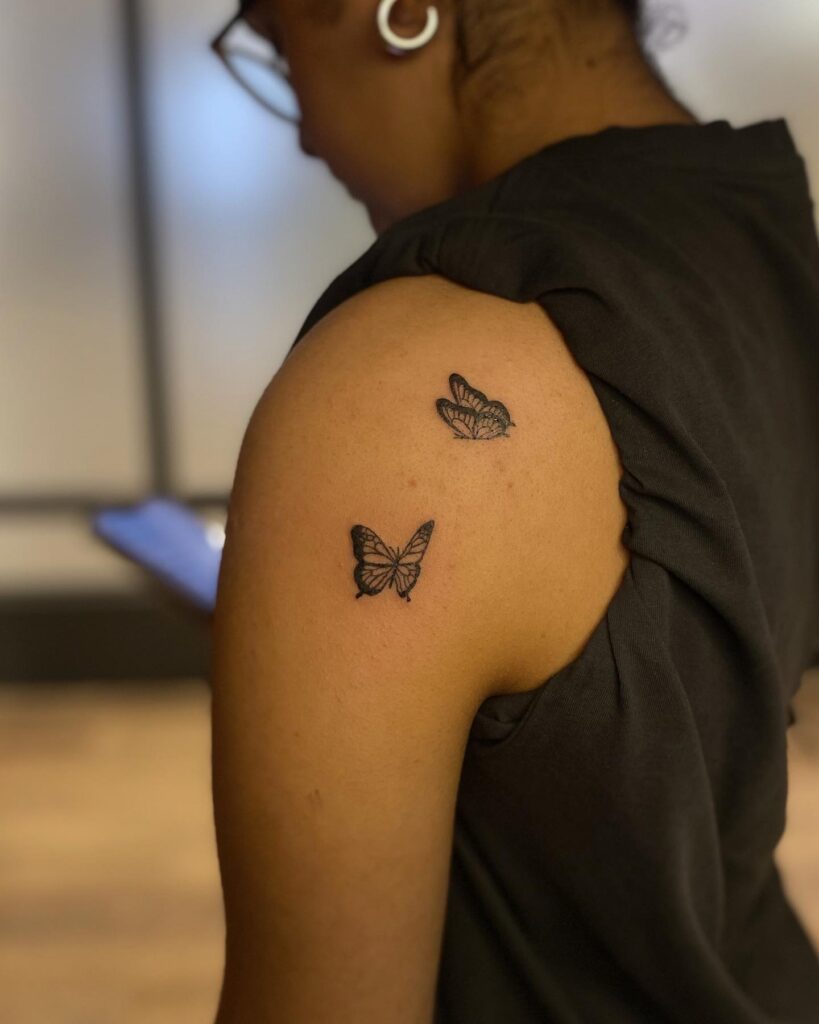 Flutter of Freedom: Dual Butterfly Shoulder Tattoo