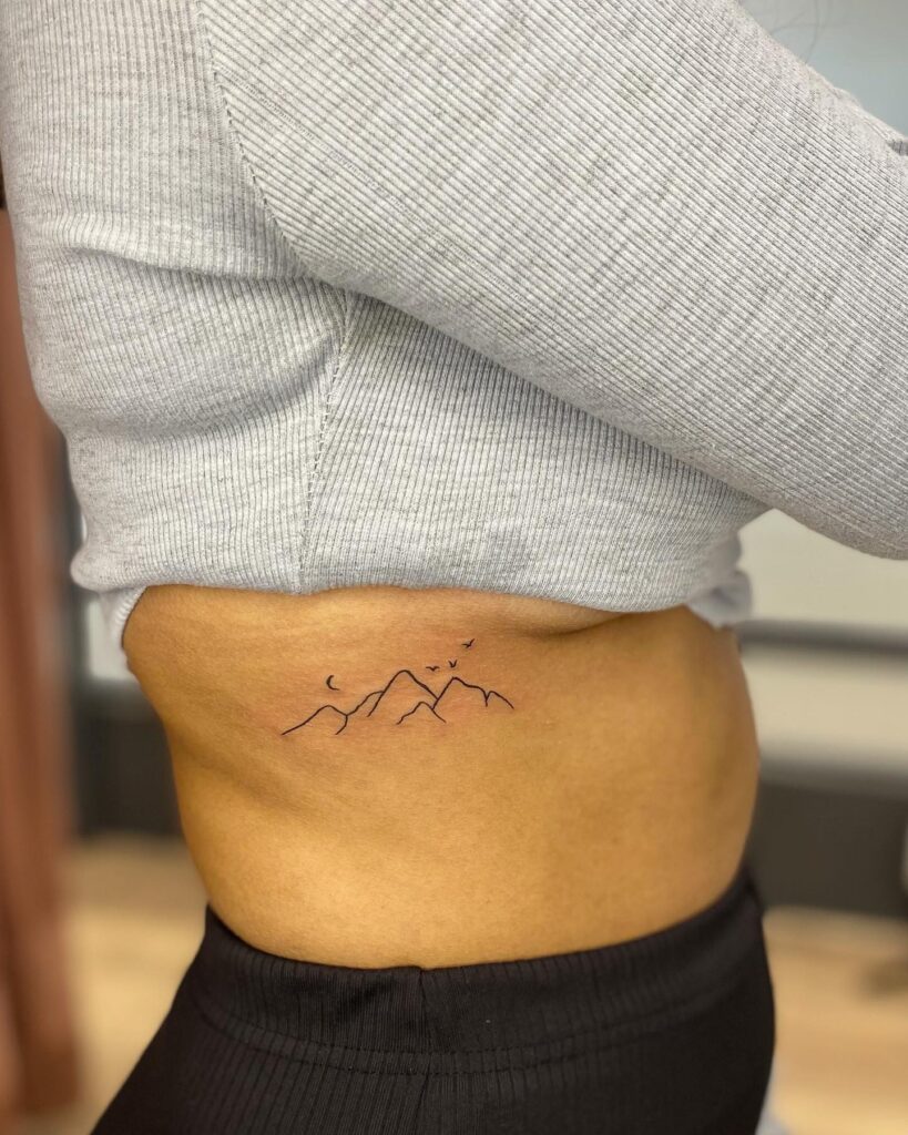 Minimalist Mountain Range: Simplistic Back Tattoo