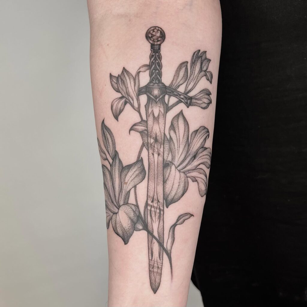 A forearm tattoo representing 'The Lovers' tarot card, symbolizing connection and choices in relationships.