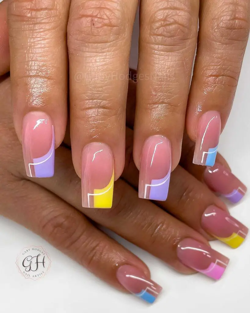 Color block nail art with geometric shapes in pastel colors, ideal for a modern spring look.