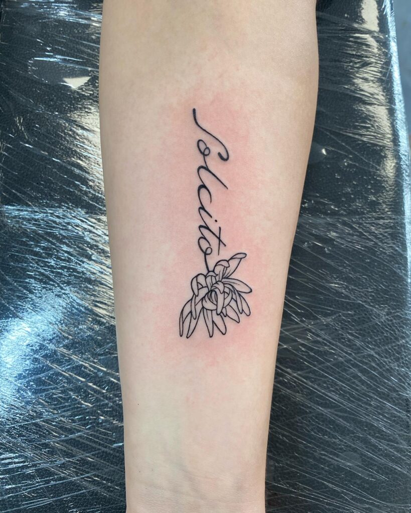 Elegant Script and Floral Forearm Tattoo