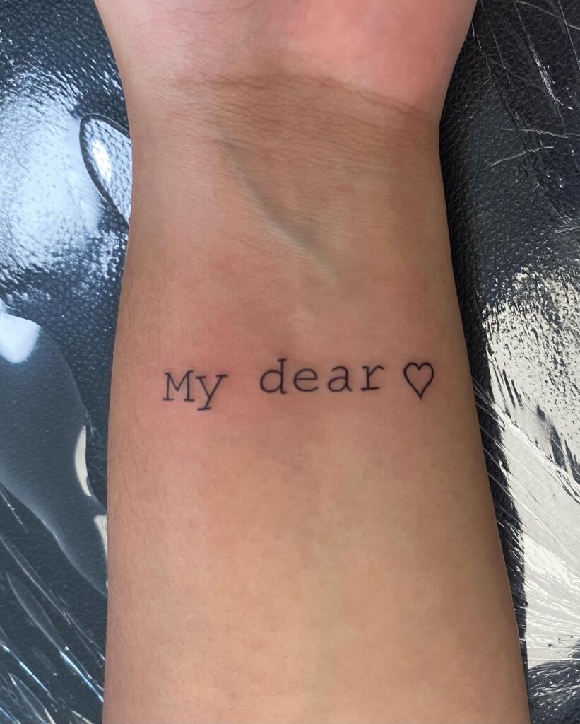 Affectionate 'My Dear' Wrist Tattoo