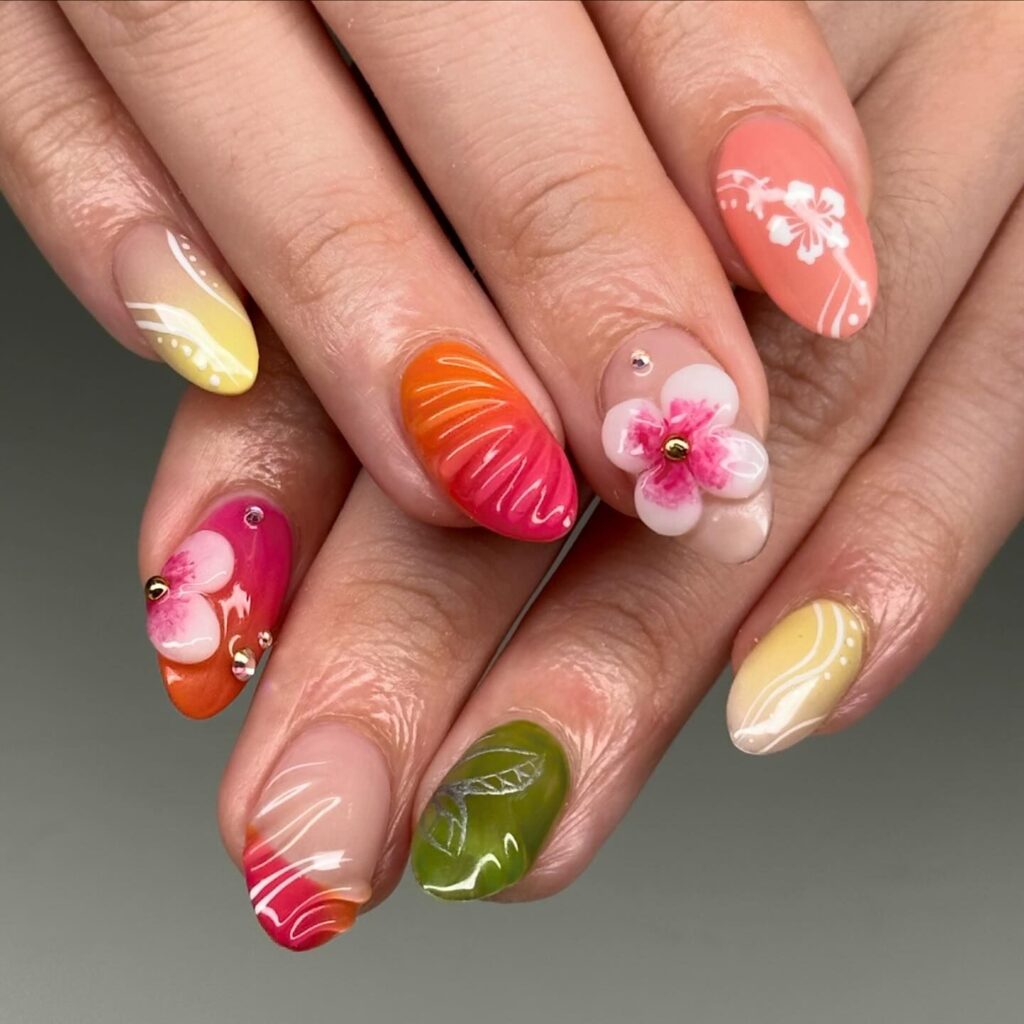 A collection of nails artfully decorated with various summer fruit designs including orange slices, strawberries, and floral accents for a juicy summer vibe.