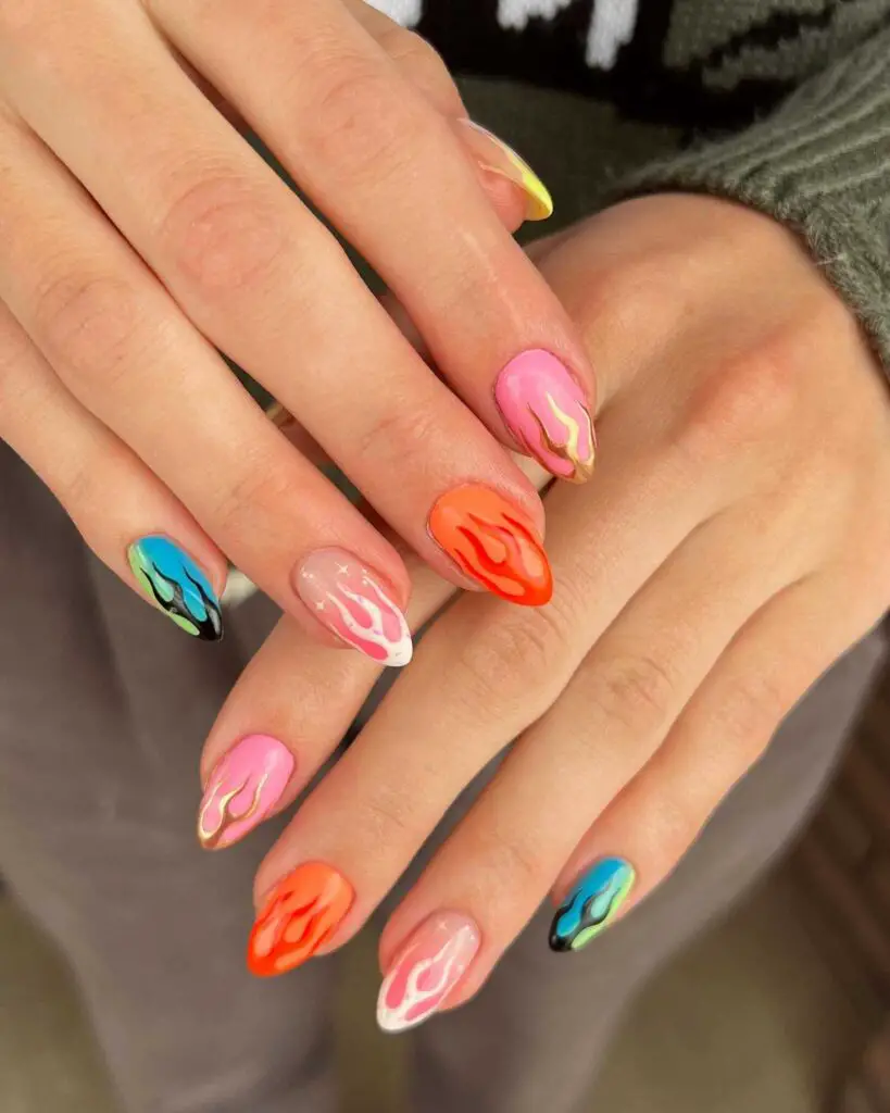 Hand with long nails painted with a psychedelic mix of swirling neon colors for a bold, retro-inspired look.