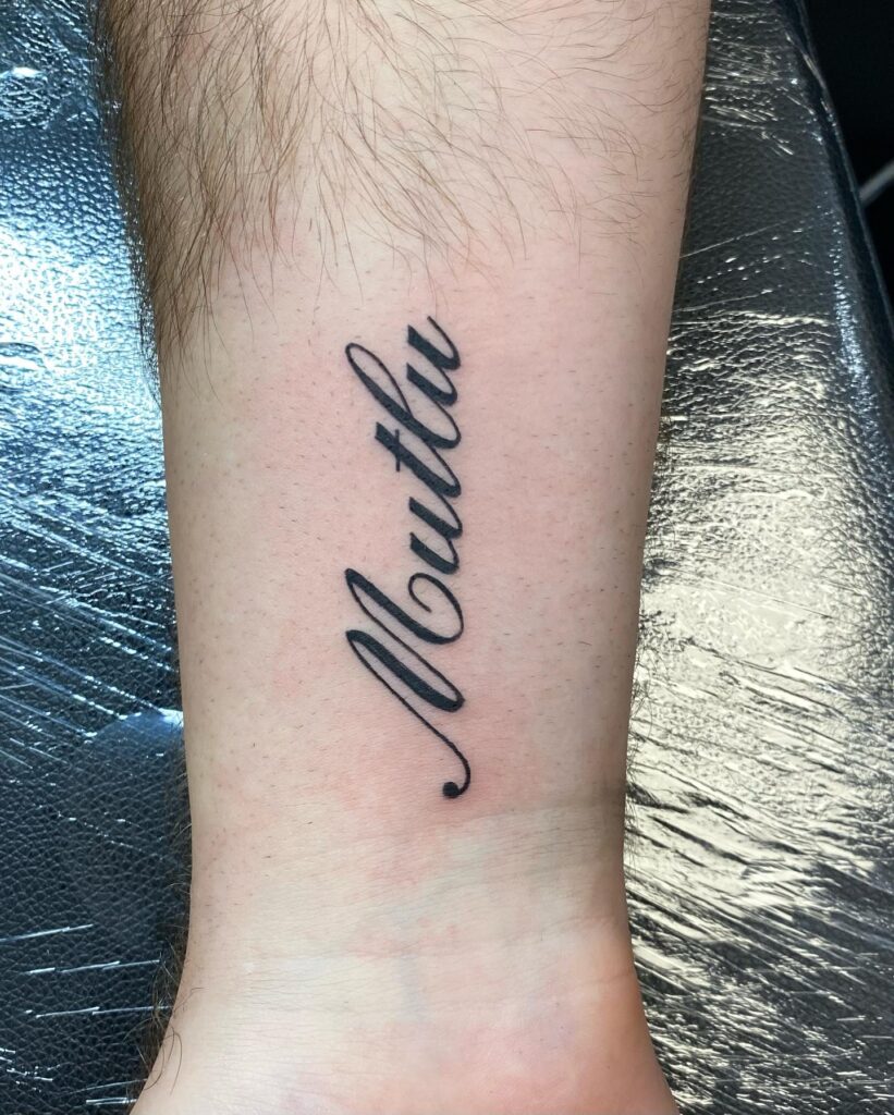 Cursive Elegance Leg Tattoo