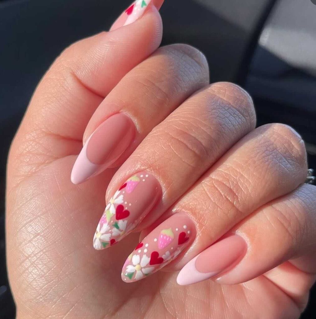 Spring nail art showcasing a playful mix of hearts and flowers in sweet, candy-inspired colors.