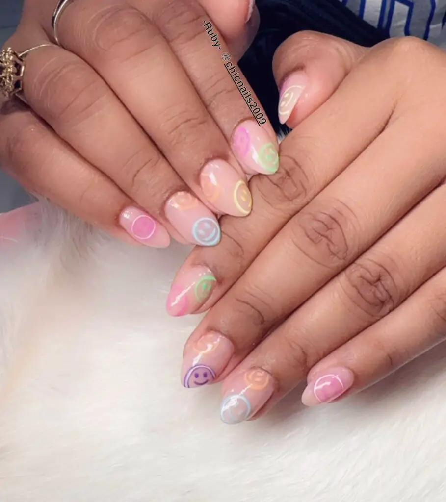 Soft pastel swirls on translucent nails, creating a playful and sweet candy-inspired nail design.