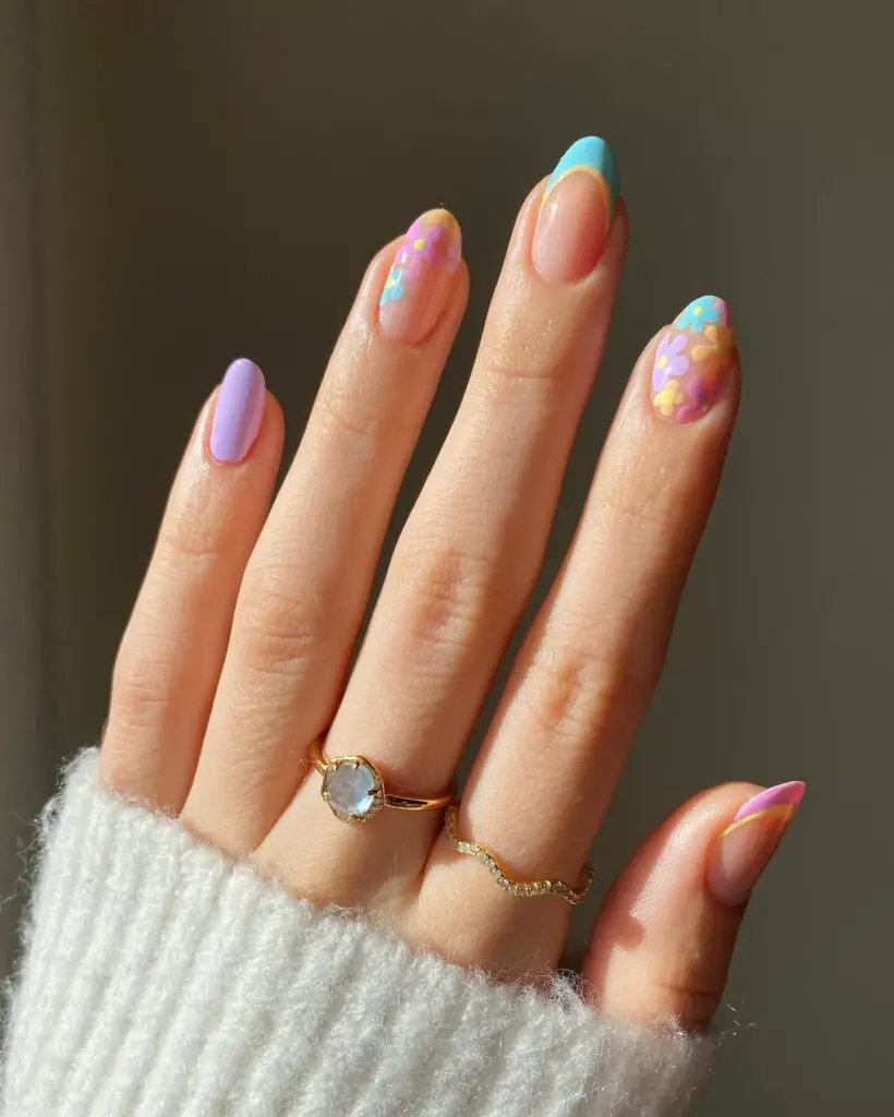 Dreamy pastel purples and blues mingled with delicate floral accents, creating a whimsical nail art perfect for the spring season.