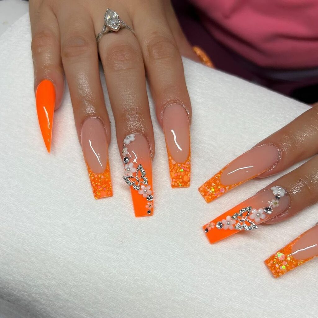 Glitter Glow: Neon-Tipped Stiletto Nails with Rhinestone Sparkle