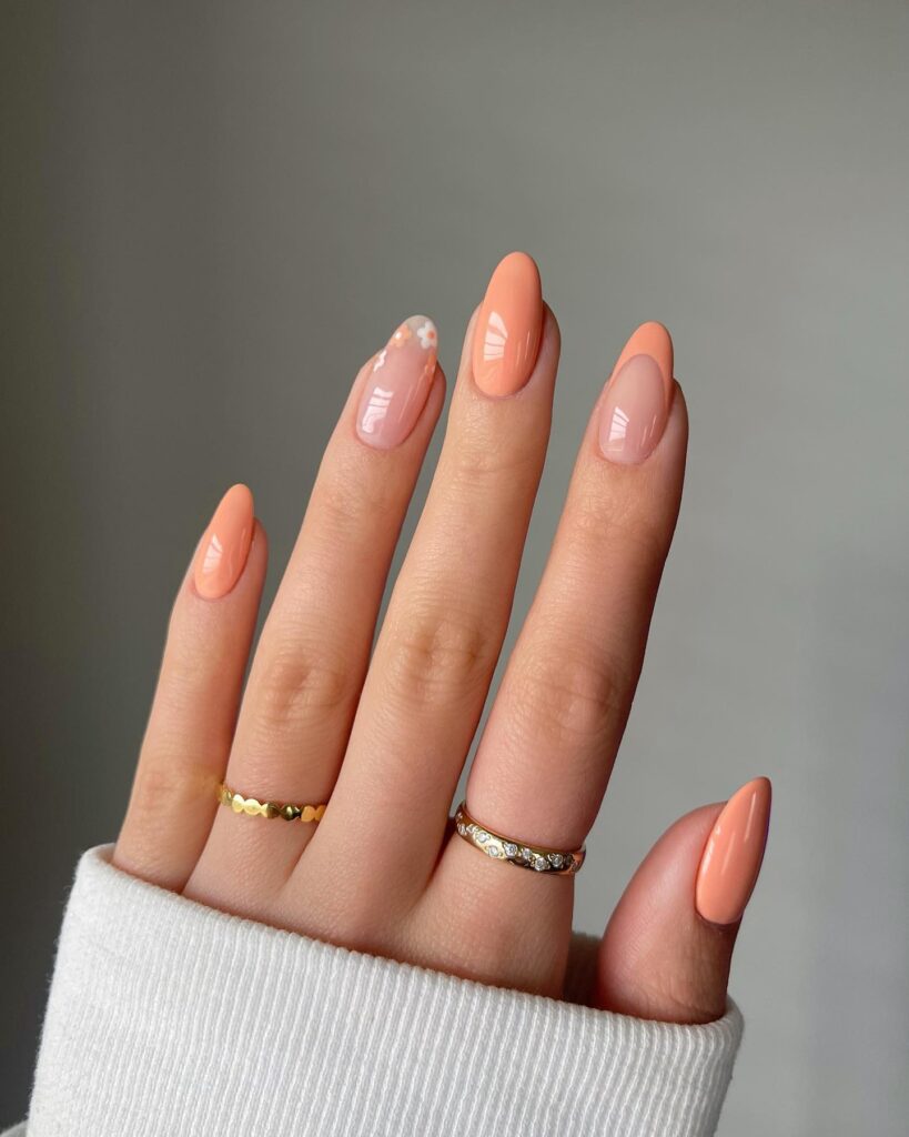 Peachy Keen Elegance: Almond Nails with Floral Accent