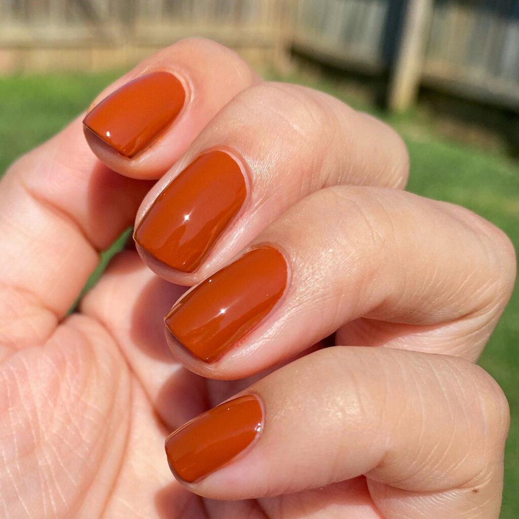 Terracotta Touch: Glossy, Rounded Nails in Warm Orange