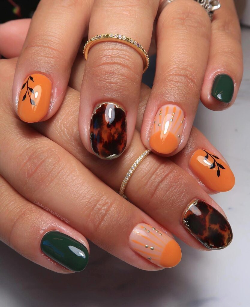 Ornate Orange: Eclectic Nails with Gold Glitter Accents