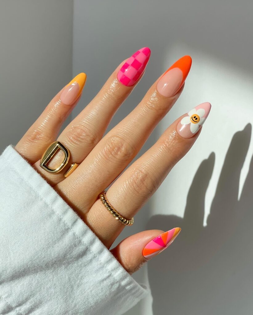 Playful Patterns: Pink Checkerboard and Orange Nail Art