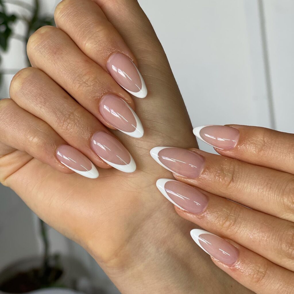 Embrace timeless beauty with a modern twist on the classic French tip manicure. These nails offer a fresh take on a beloved style, blending tradition with contemporary elegance.