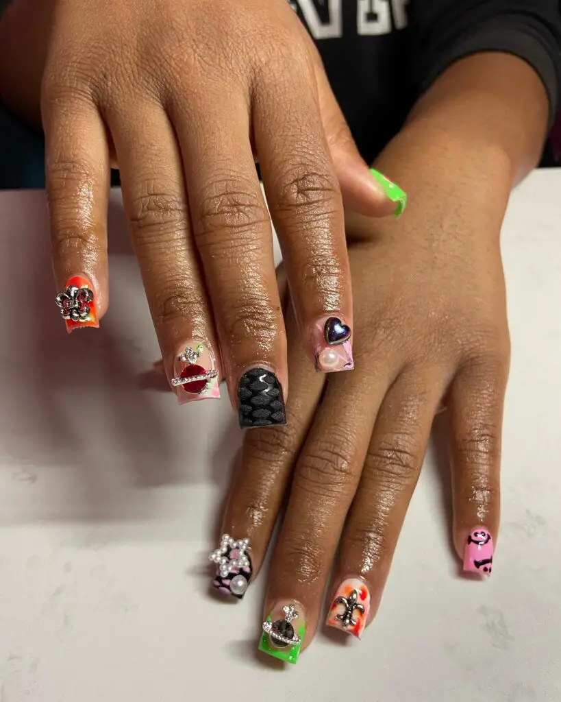 Unleash your wild side with this eclectic mix of nail art designs. From glittery hearts to abstract patterns, each nail is a canvas for creativity and color.